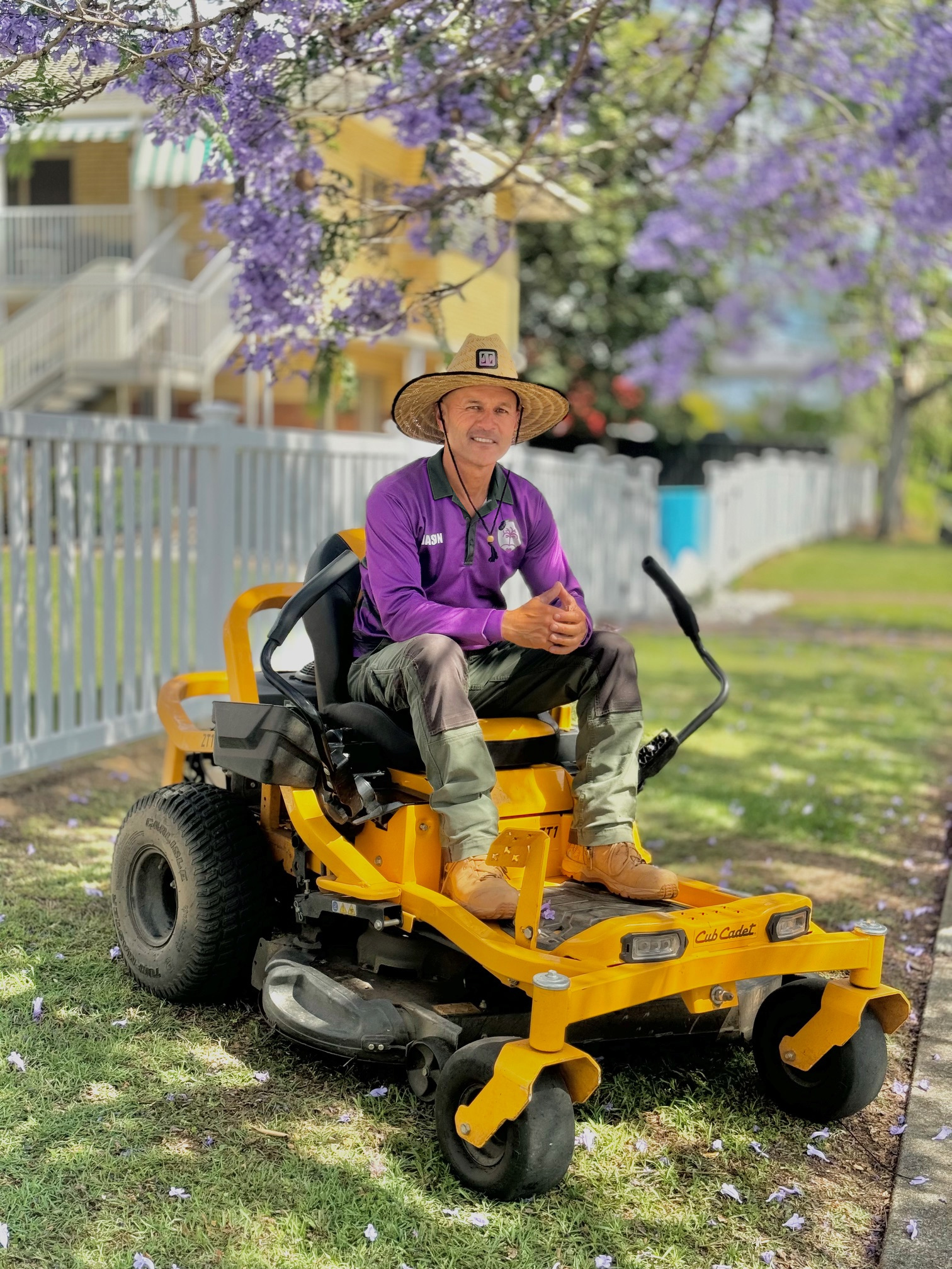 Jason O’Dea seated on an Excel Grounds Maintenance ride-on mower